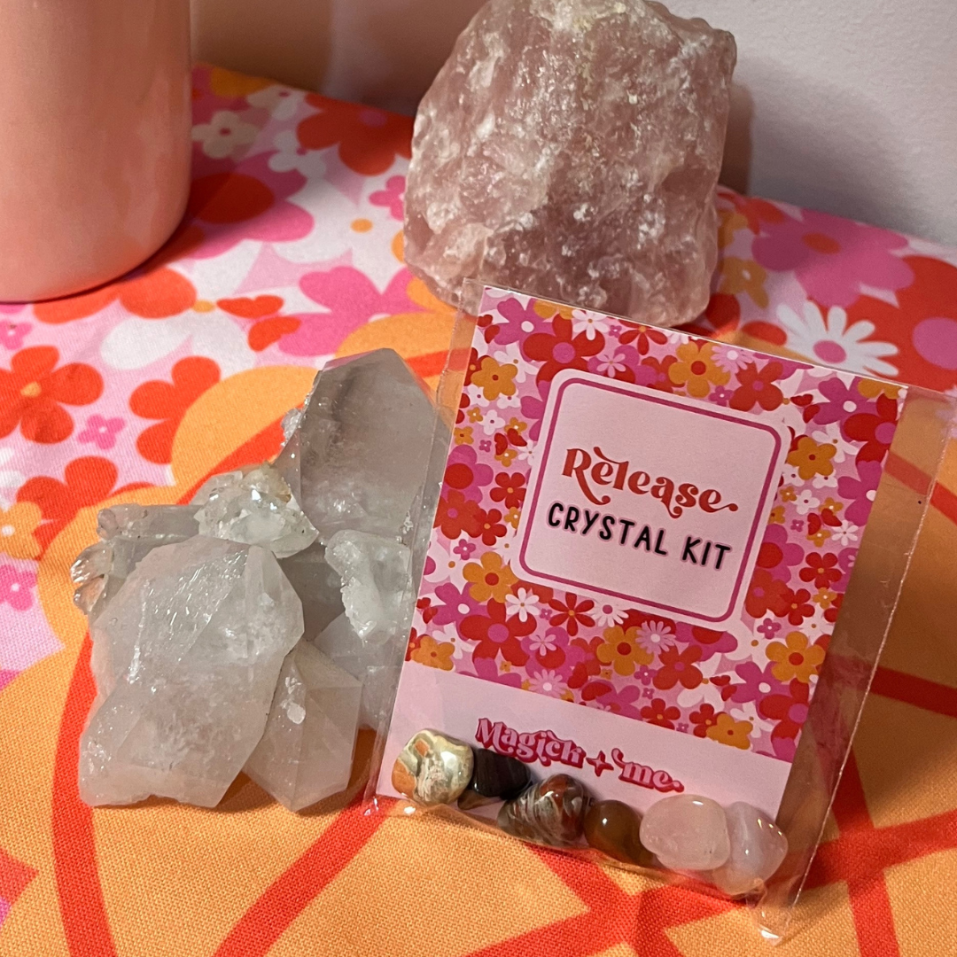 Crystal kit with raw crystals on a colorful surface