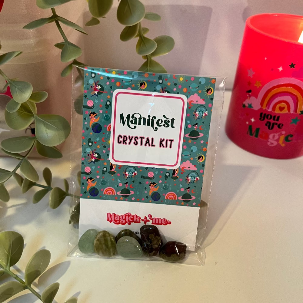 Manifesting Crystal kit packaging with decorative elements on a light background